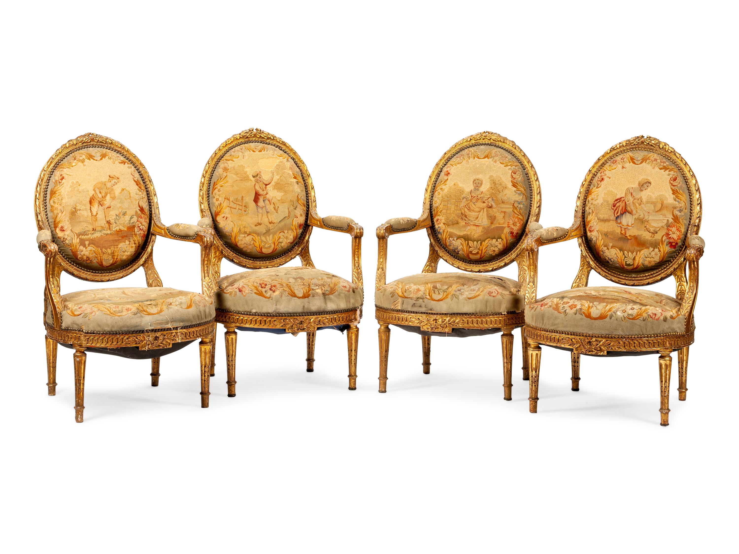 A Set of Four Louis XVI Style Aubusson Tapestry Upholstered Giltwood Fauteuils — CIRCA 1900