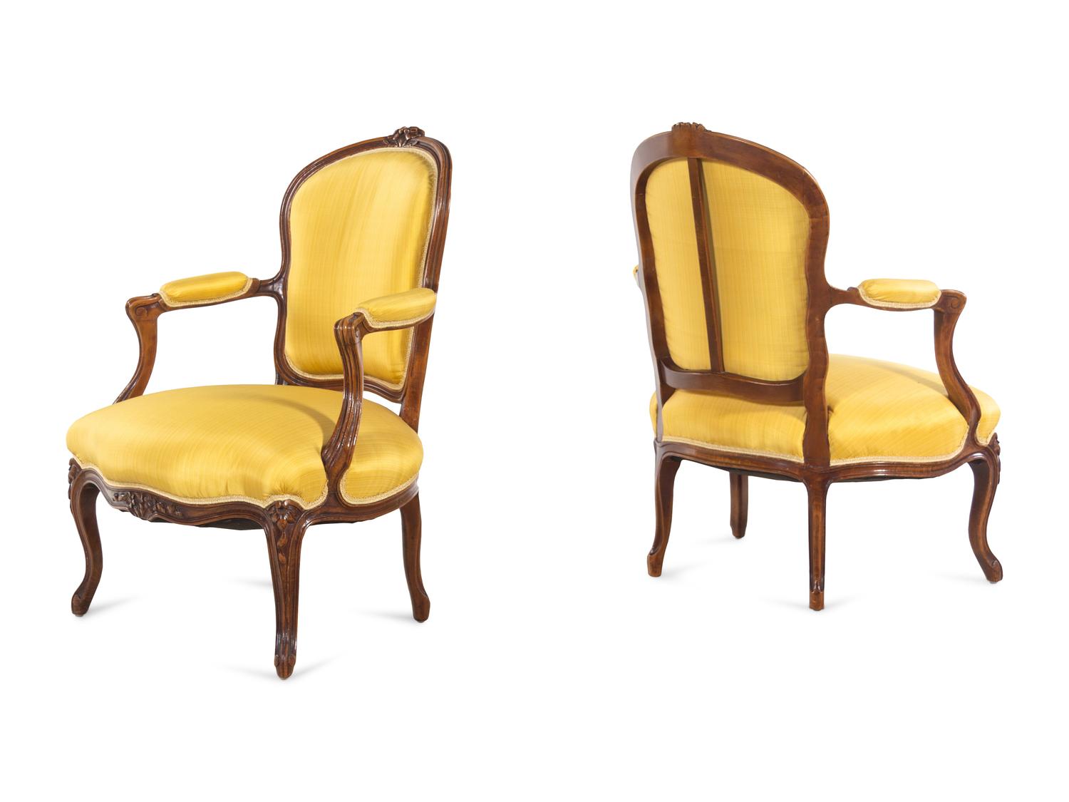 A Set of Four Louis XV Style Walnut Fauteuils