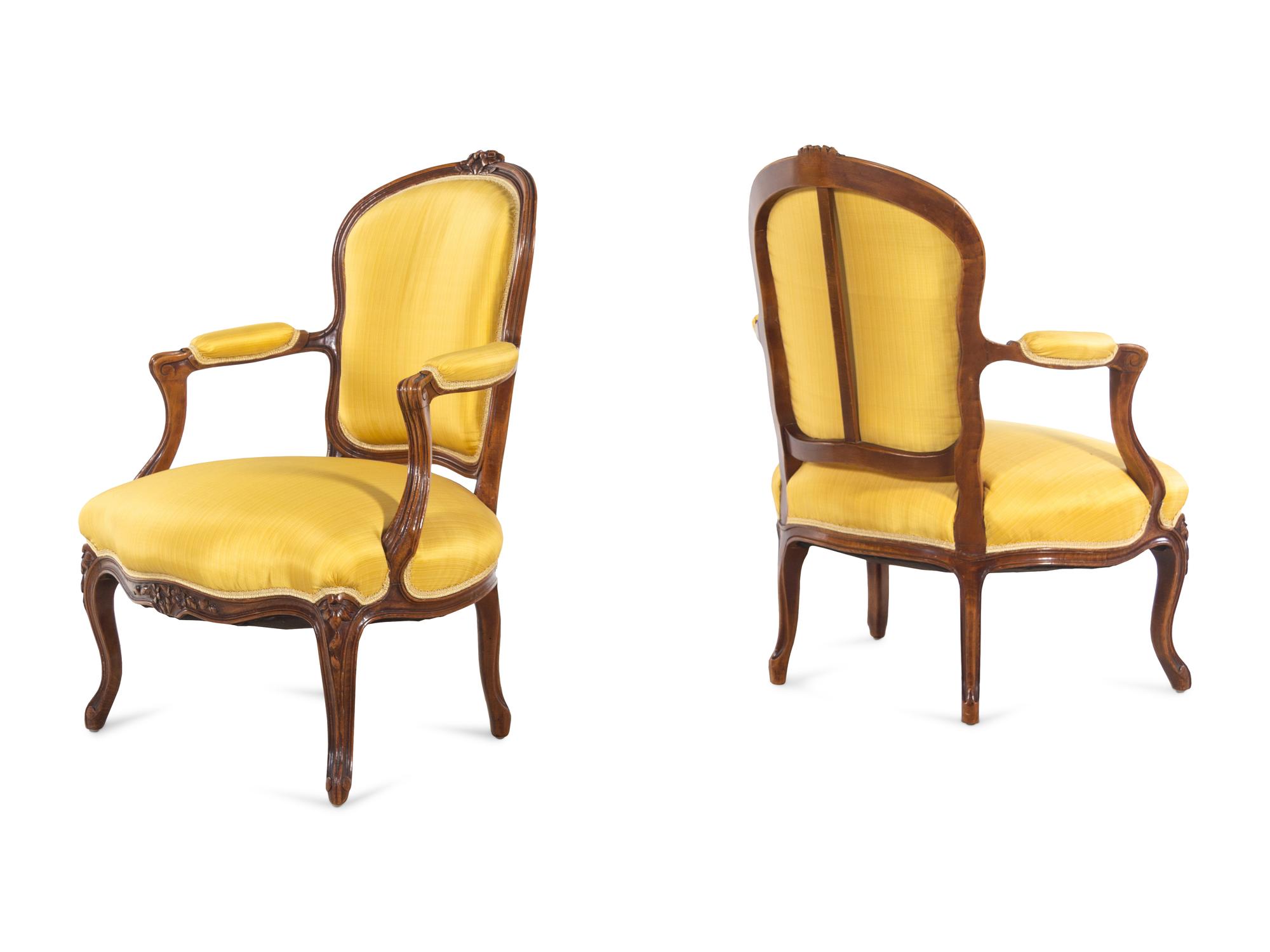A Set of Four Louis XV Style Walnut Fauteuils