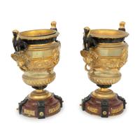 A Pair of French Egyptian Revival Gilt Bronze and Marble Urns