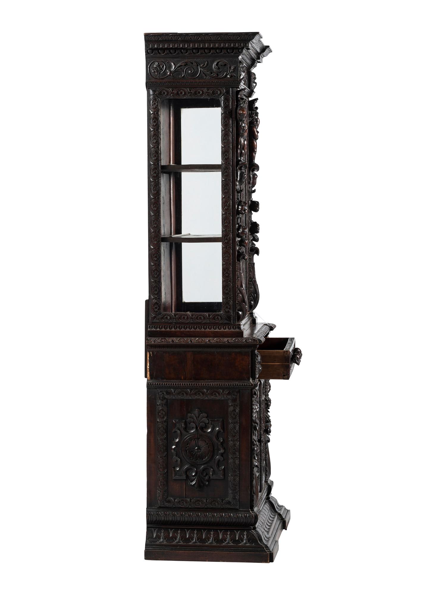 An Italian Renaissance Revival Carved Walnut Bookcase or Vitrine Cabinet