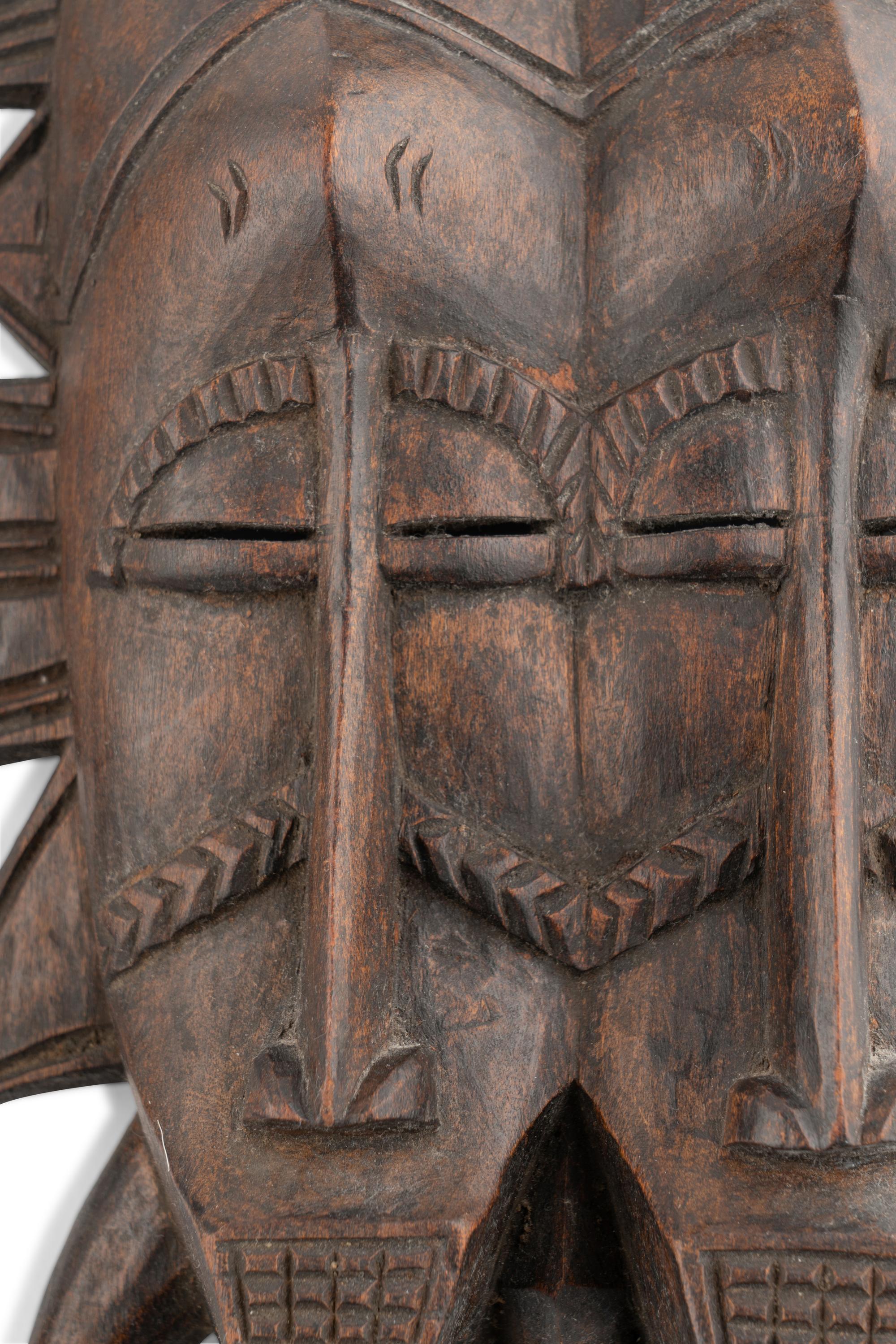 A Group of Three West African Carved Masks