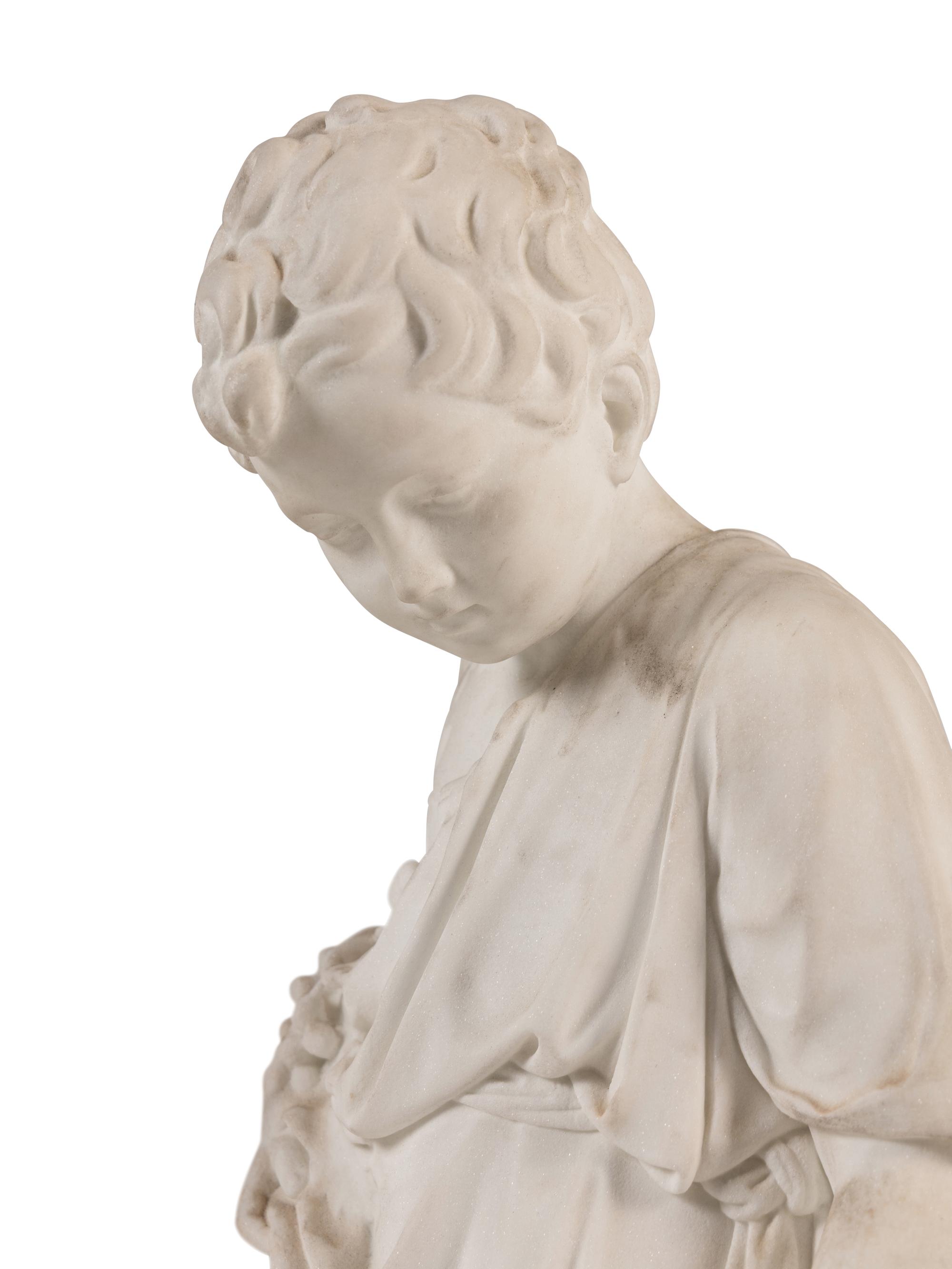A Pair of Italian Carved Marble Figures of a Boy and Girl