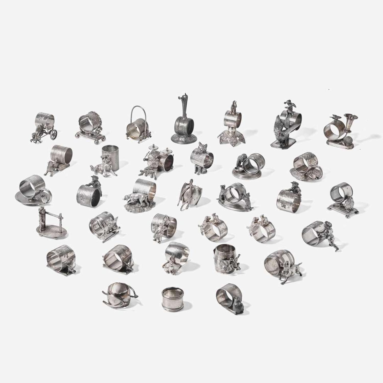 A collection of thirty-four Victorian silverplated and pewter napkin holders Various American and Canadian makers, Connecticut, Massachusetts, and Ontario, late 19th century