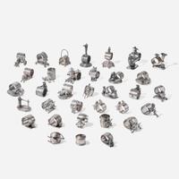 A collection of thirty-four Victorian silverplated and pewter napkin holders Various American and Canadian makers, Connecticut, Massachusetts, and Ontario, late 19th century