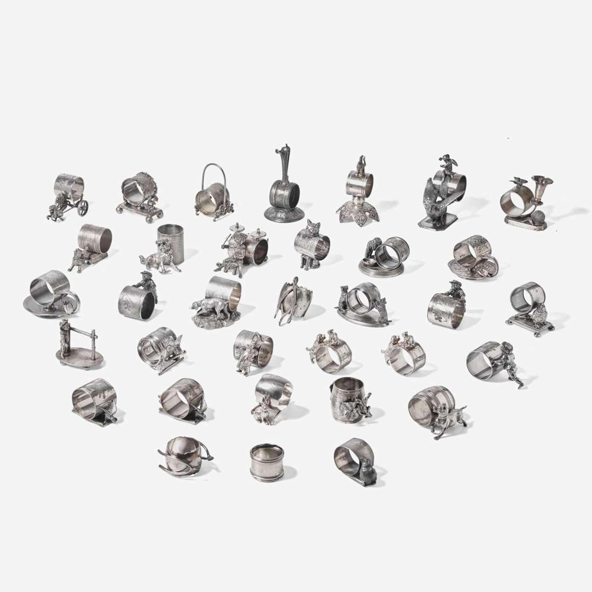 A collection of thirty-four Victorian silverplated and pewter napkin holders Various American and Canadian makers, Connecticut, Massachusetts, and Ontario, late 19th century