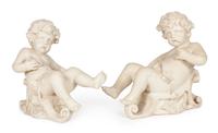 A Pair of Cast Figures of Bacchic Putti Height 21 inches.