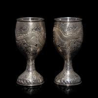 A Pair of Chinese Export Silver 'Dragon' Wine Cups, 20th Century 近代 外銷鏨云龍紋酒杯一對