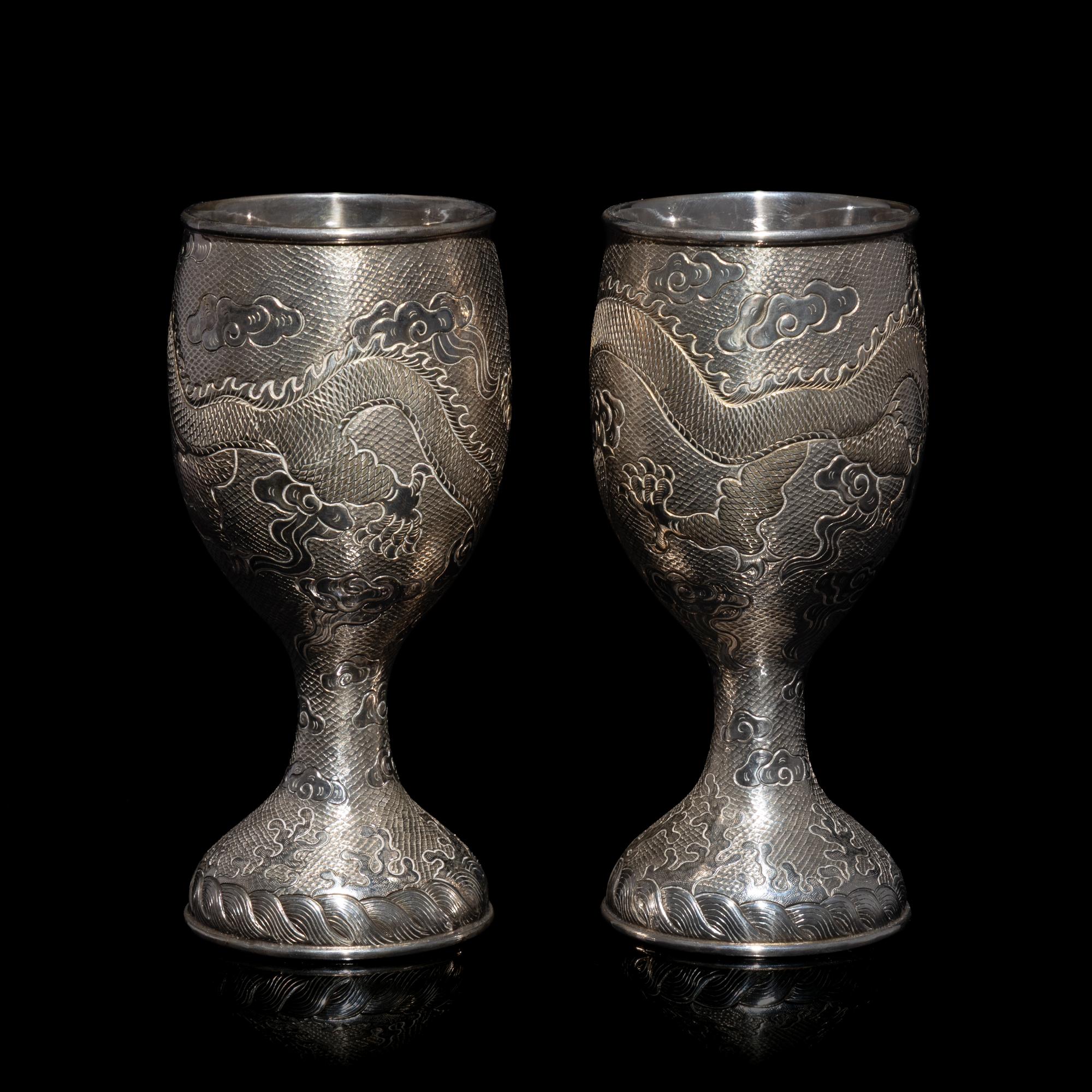 A Pair of Chinese Export Silver 'Dragon' Wine Cups, 20th Century 近代 外銷鏨云龍紋酒杯一對