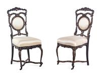A Pair of Louis XV Style Ebonized and Gilded Side Chairs