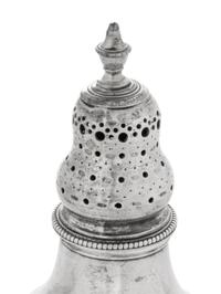 A Near Pair of George III Silver Casters