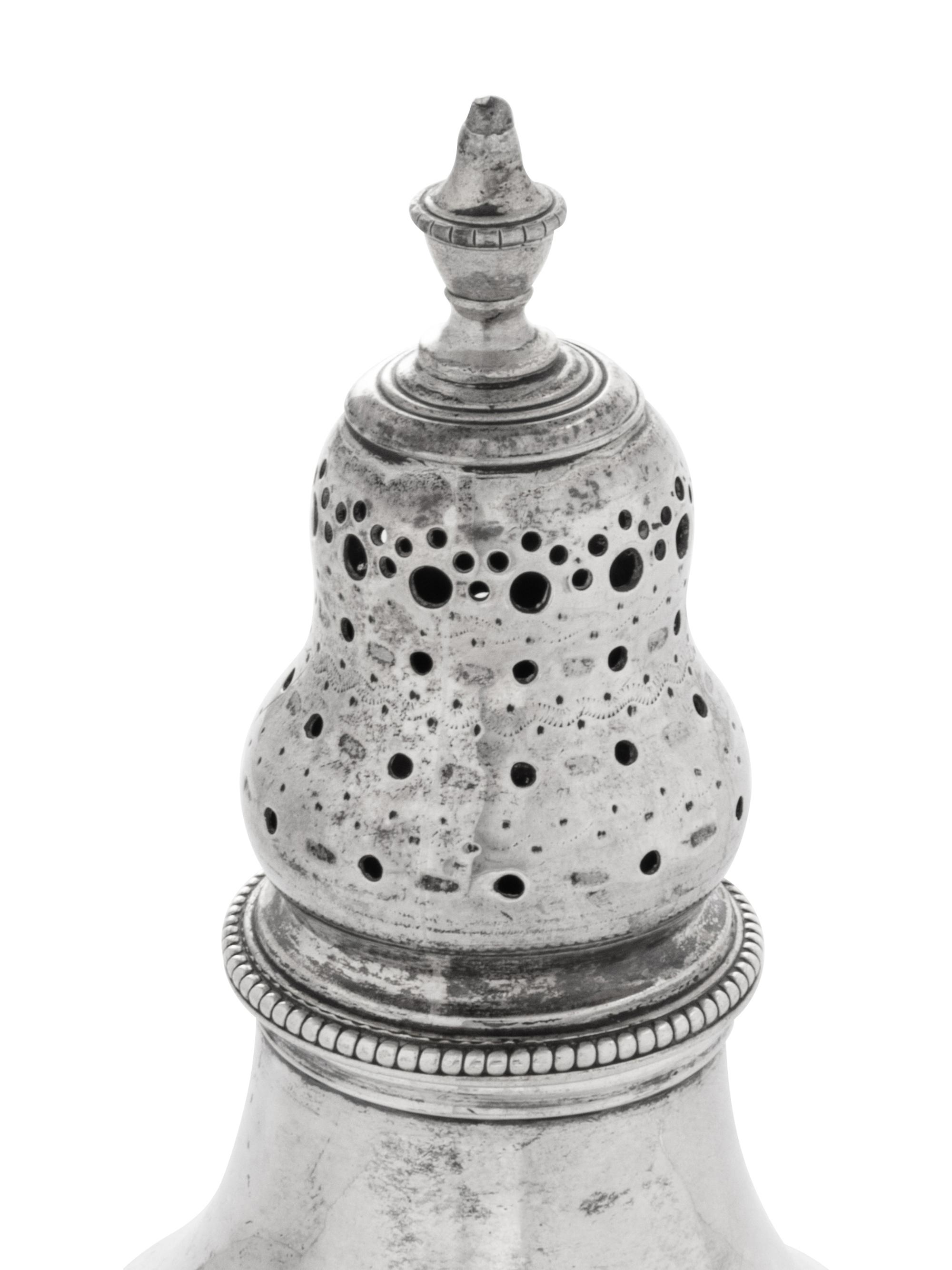 A Near Pair of George III Silver Casters