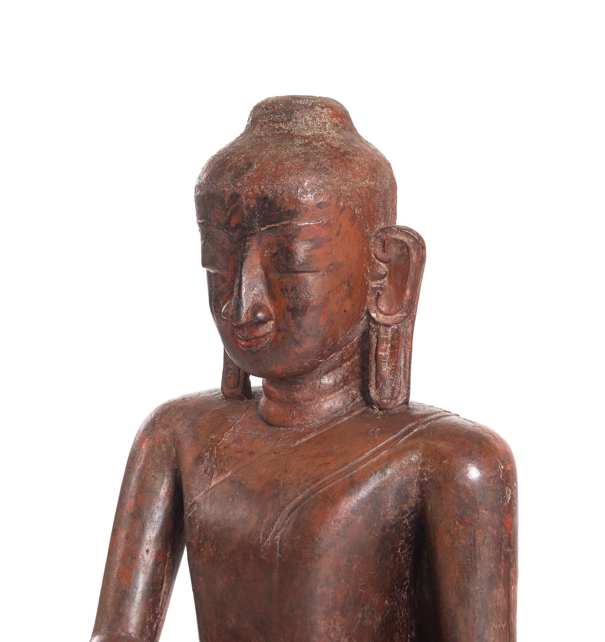 A Burmese Carved Wood Figure of Seated Buddha