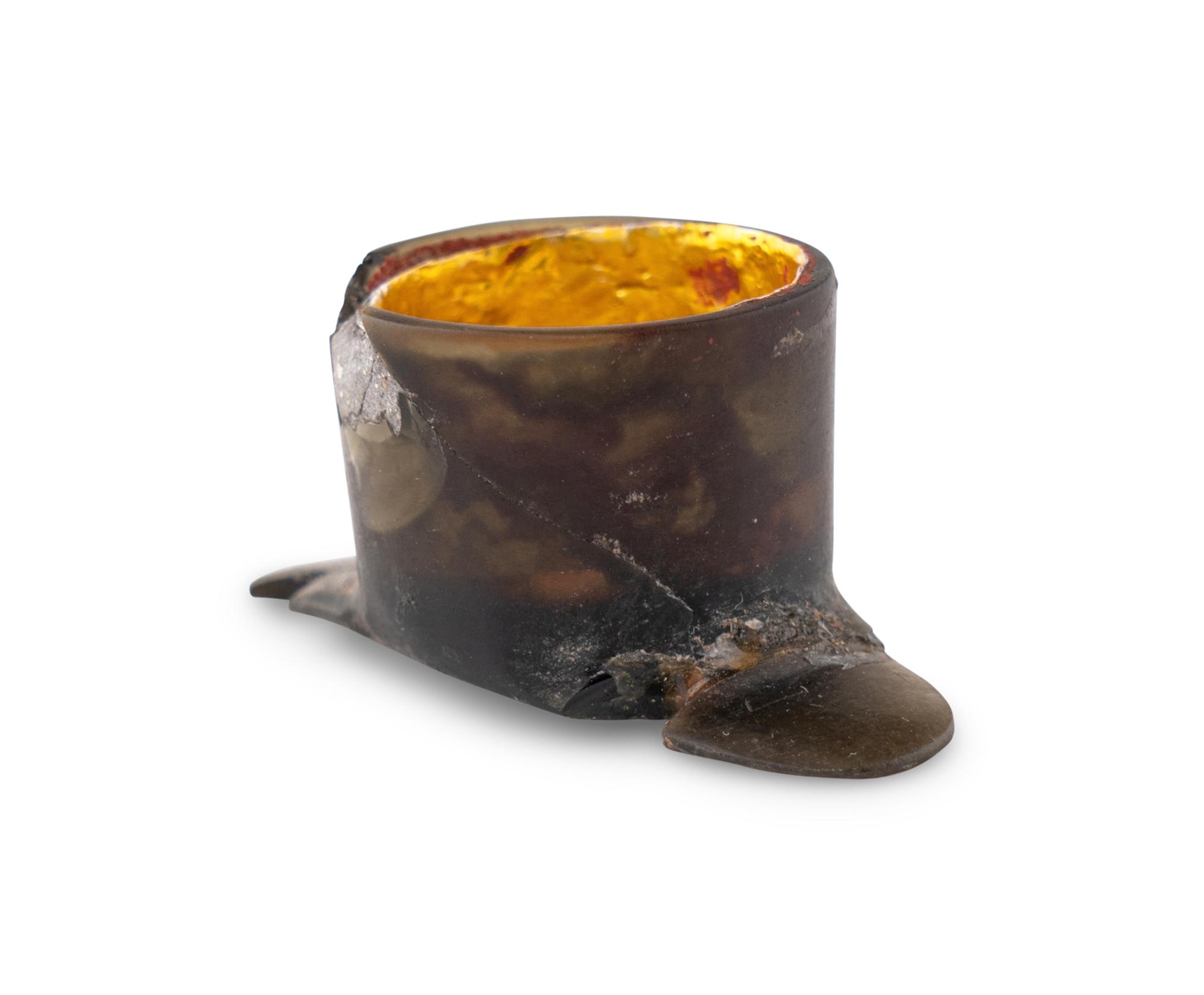 An Aztec Gold-Gilt Obsidian Labret