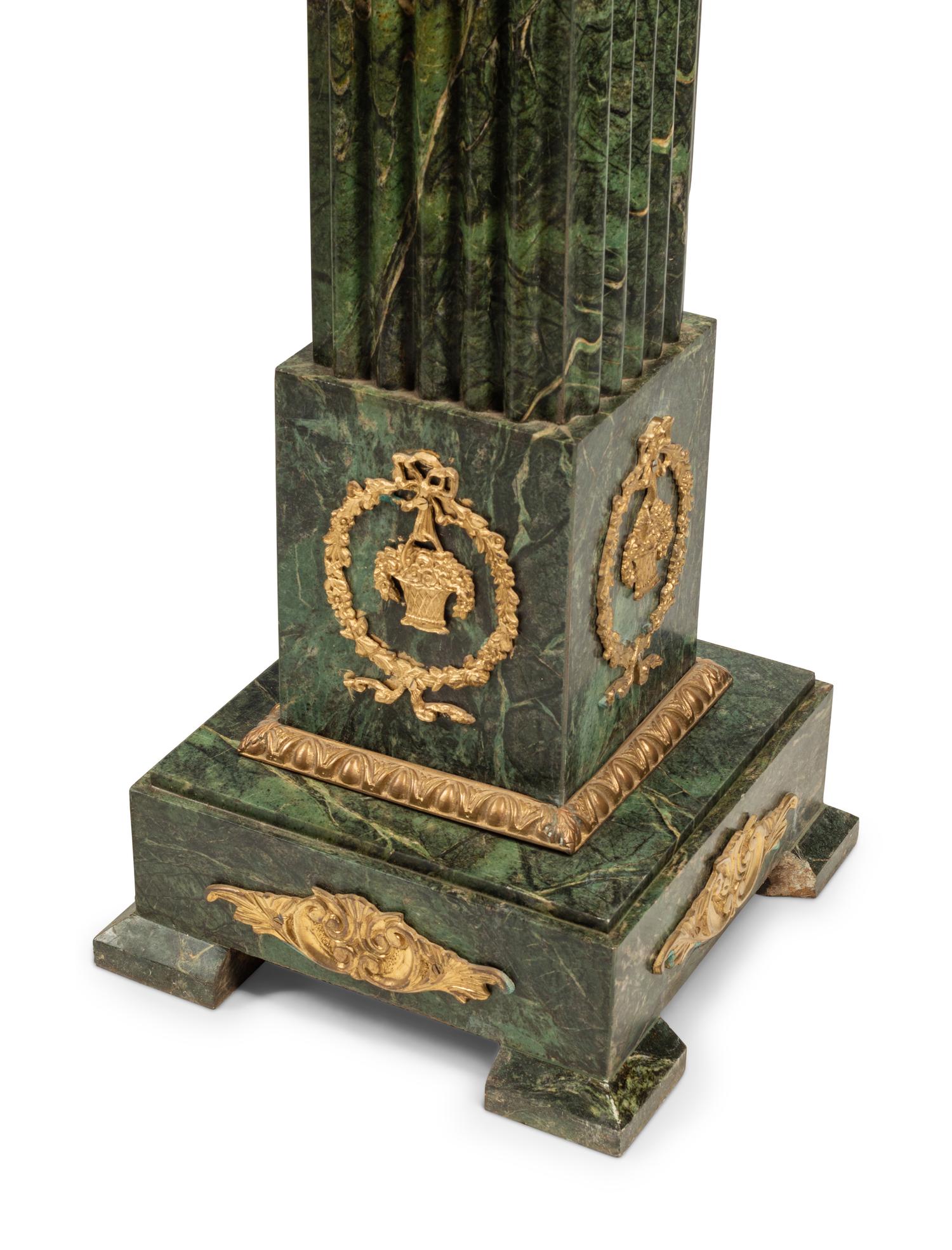 A Pair of Continental Gilt Bronze Mounted Marble Pedestals