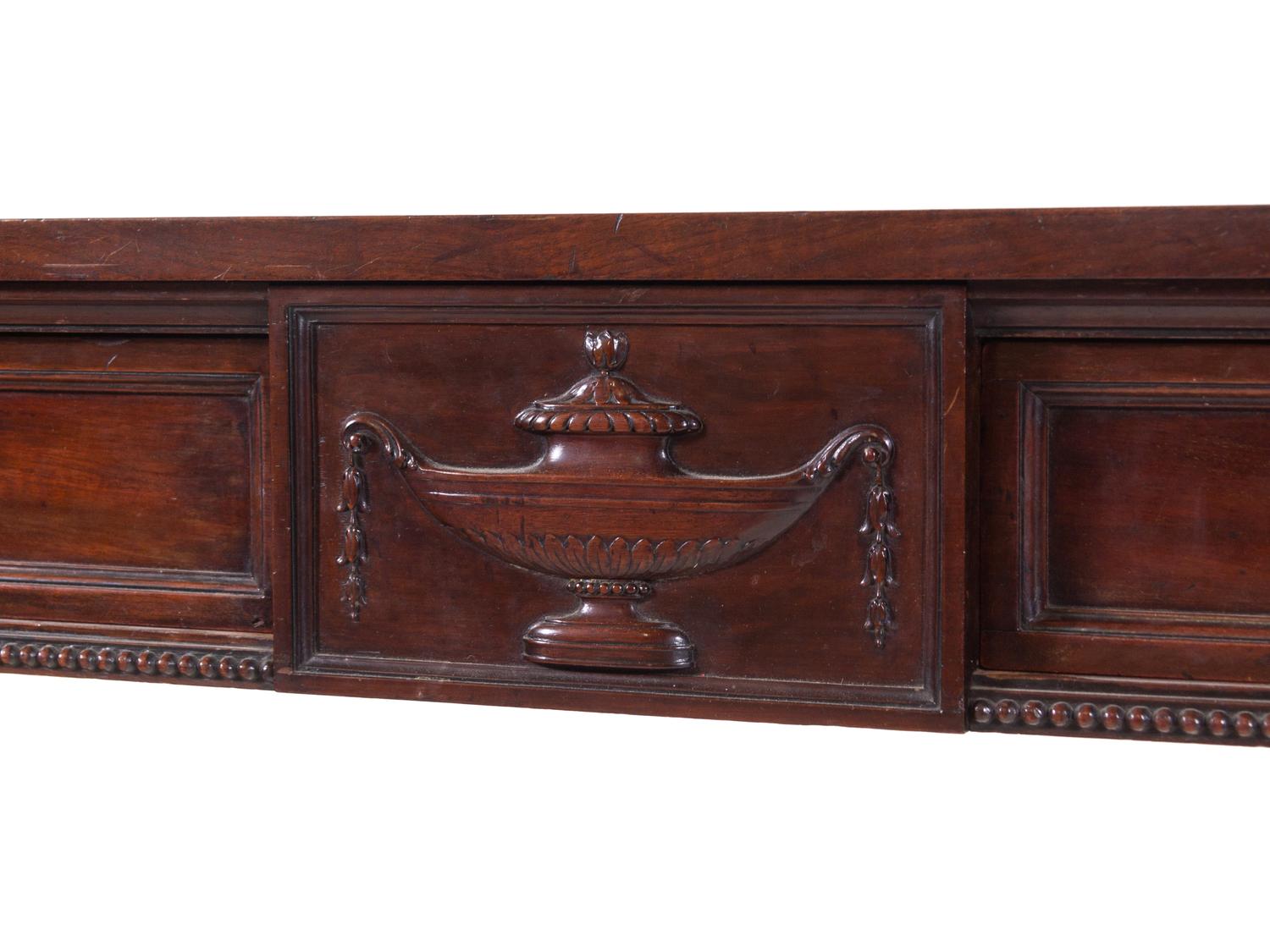 An Edwardian Carved and Figured Mahogany Double Pedestal Sideboard and a Pair of Urn-Form Cutlery Boxes