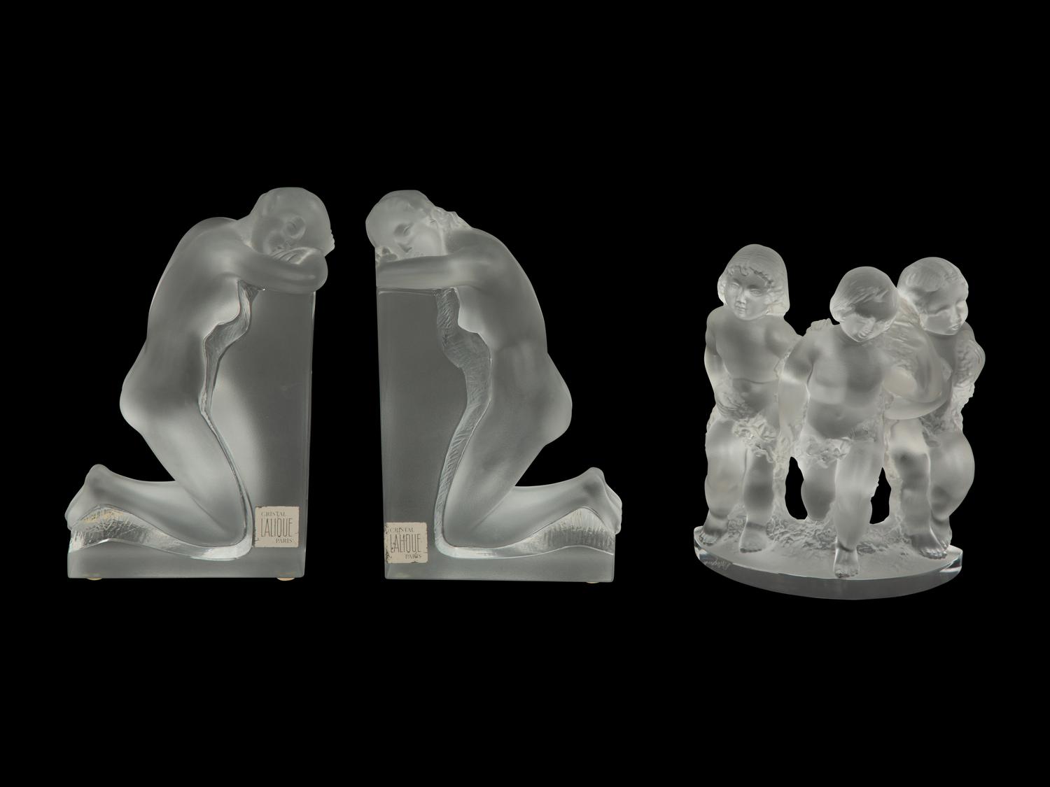 A Pair of Lalique Reverie Bookends and a Bacchantes Figural Group
