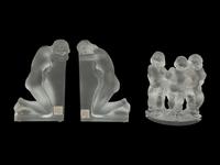 A Pair of Lalique Reverie Bookends and a Bacchantes Figural Group