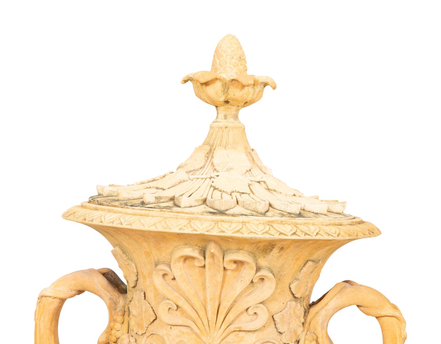A Pair of Cast Terra Cotta Covered Garden Urns on Painted Wood Pedestals