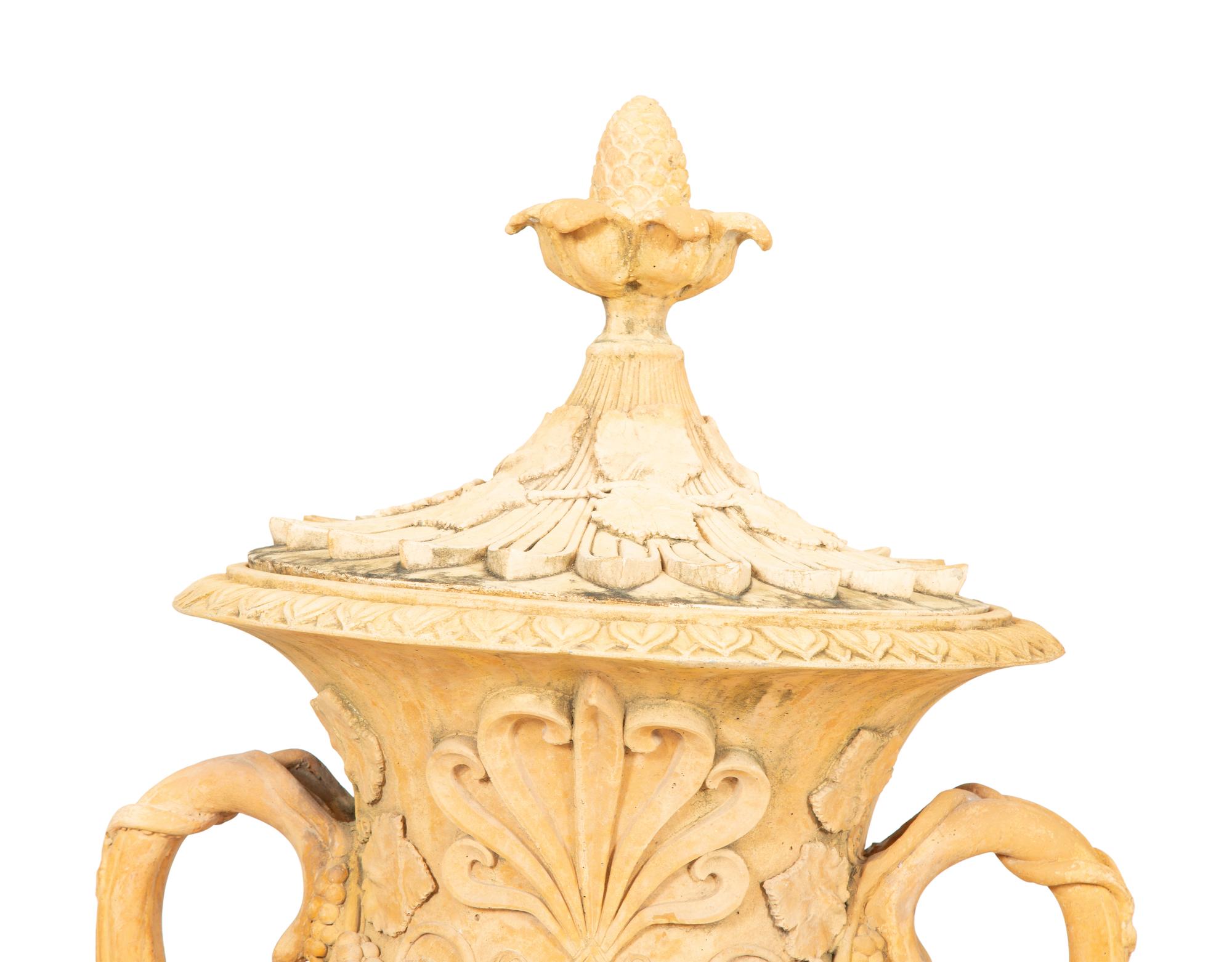 A Pair of Cast Terra Cotta Covered Garden Urns on Painted Wood Pedestals