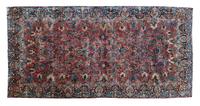 A Tabriz Wool Rug 19 feet 1/2 inches x 10 feet 2 inches.