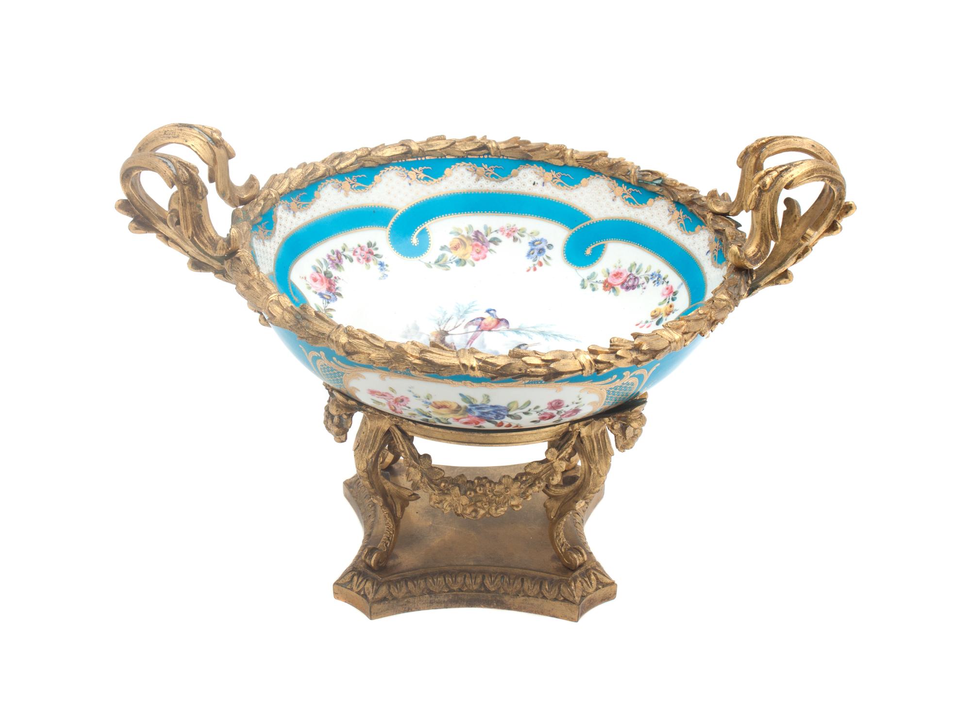 A Sevres Gilt Bronze Mounted Center Bowl Width over handles 14 1/4 inches. — 19TH CENTURY