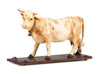 A Wood and Leather Mooing Cow-Form Pull Toy