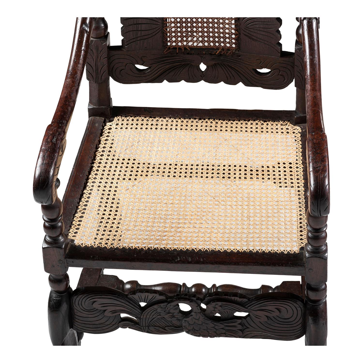 A William and Mary Swan-and-Leaf Carved and Cane Upholstered Oak Armchair