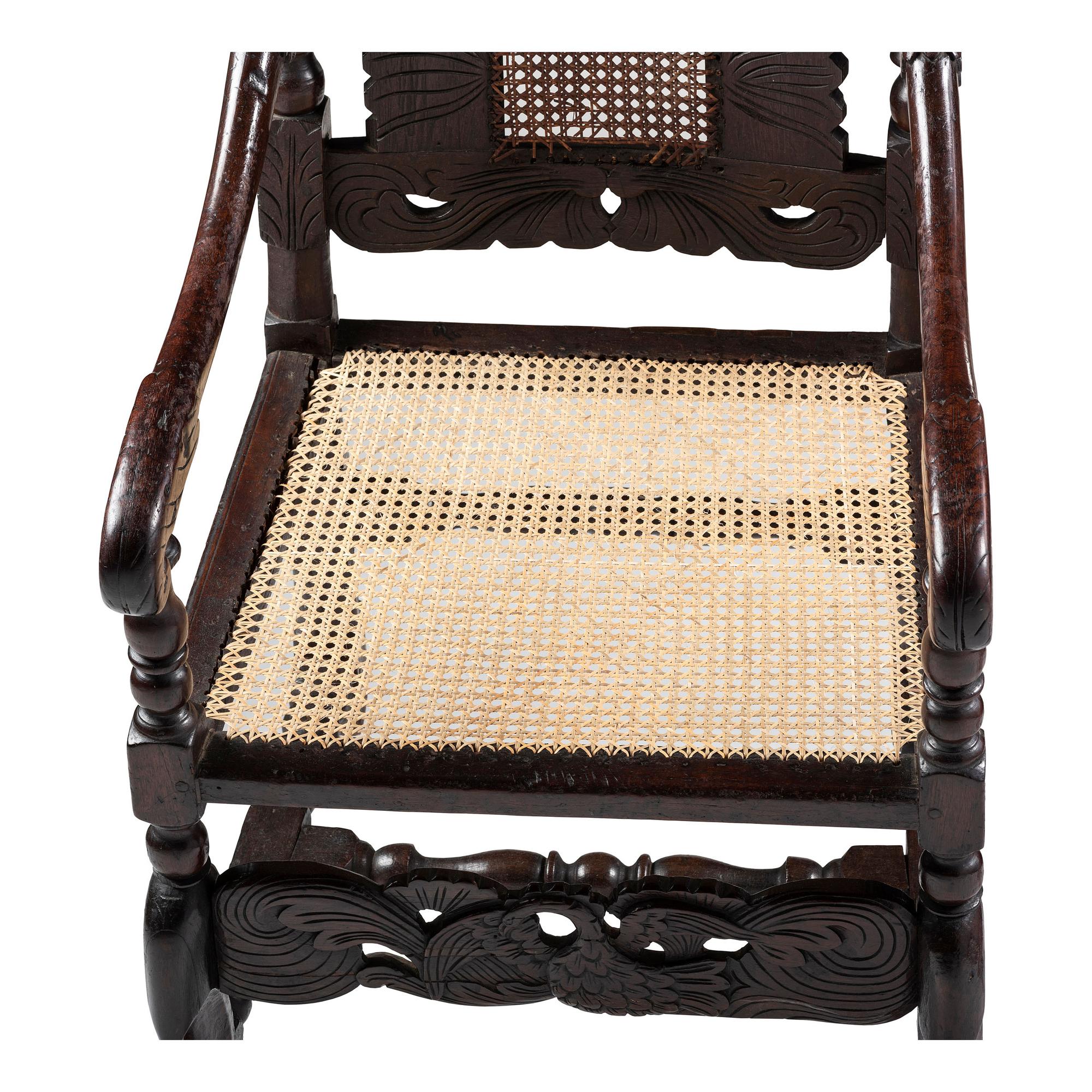 A William and Mary Swan-and-Leaf Carved and Cane Upholstered Oak Armchair