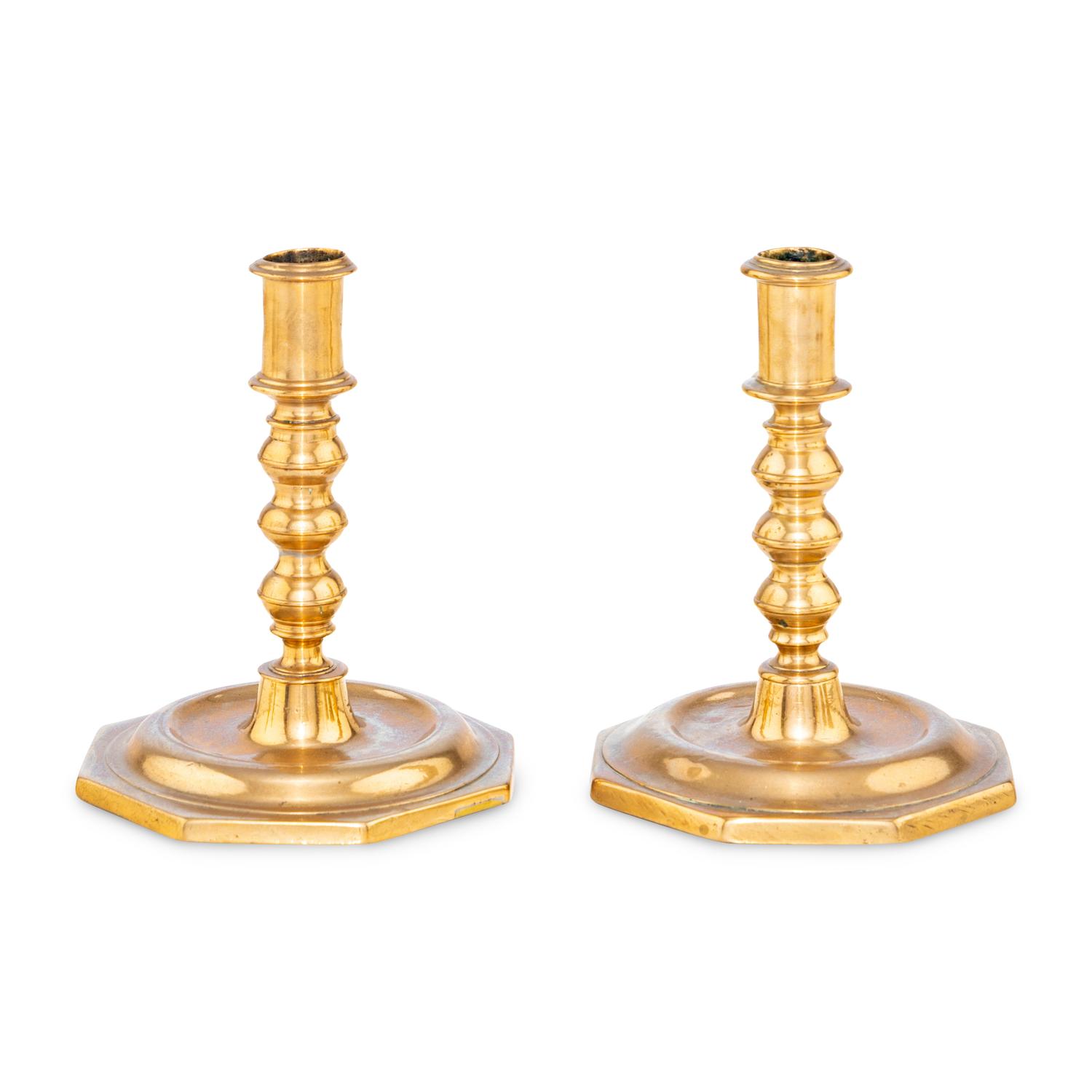 A Pair of Spanish Bell Metal Candlesticks