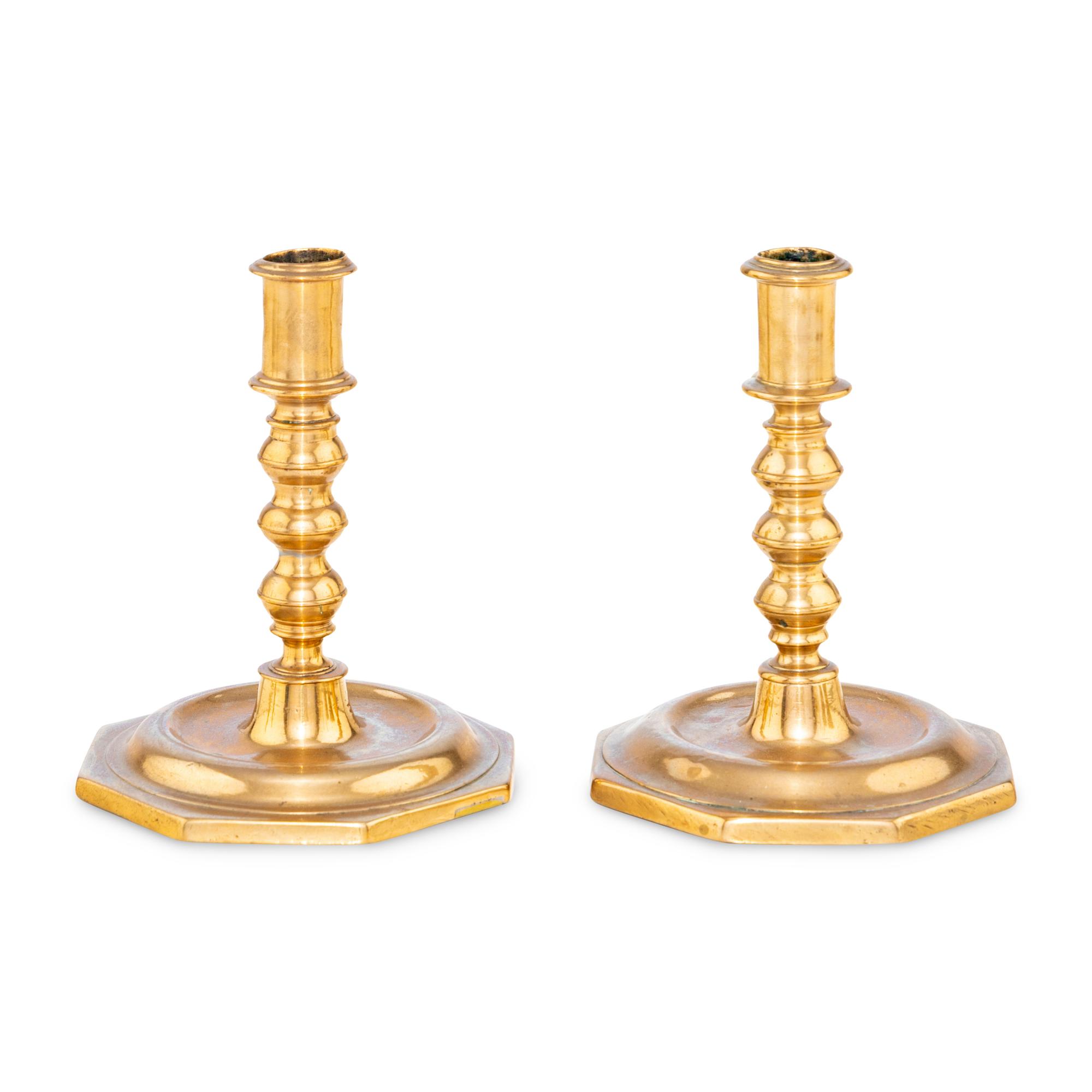 A Pair of Spanish Bell Metal Candlesticks