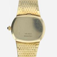 A 14K yellow gold wristwatch, Universal