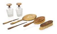 An American 14 Karat Yellow Gold Mounted Dresser Set, Wm. B. Kerr & Co., Newark, NJ, 20th Century, comprising a mirror, two brushes, a