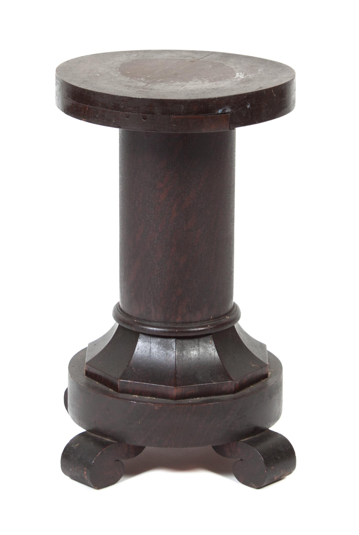 A Wood Low Pedestal Height 20 inches.