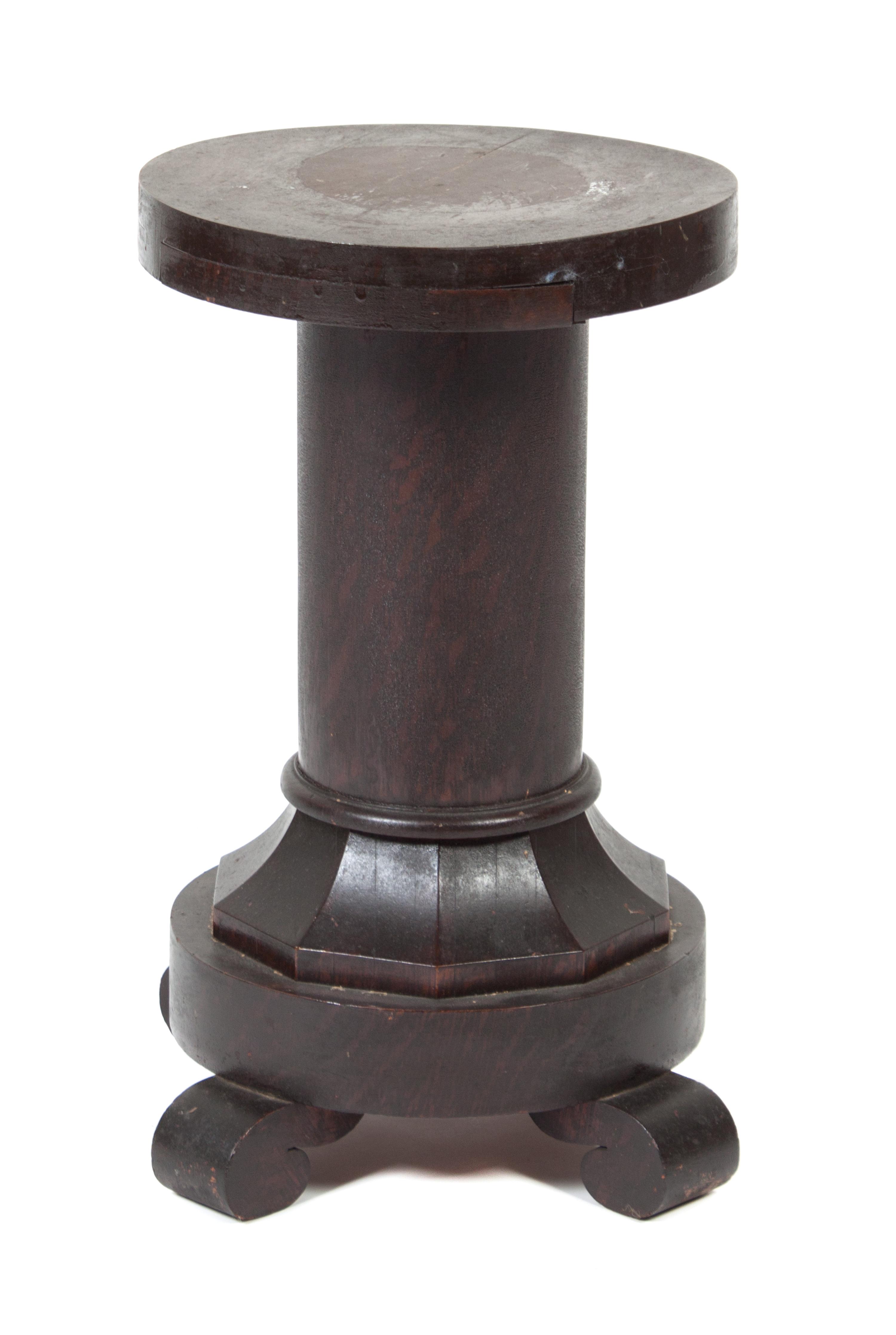 A Wood Low Pedestal Height 20 inches.