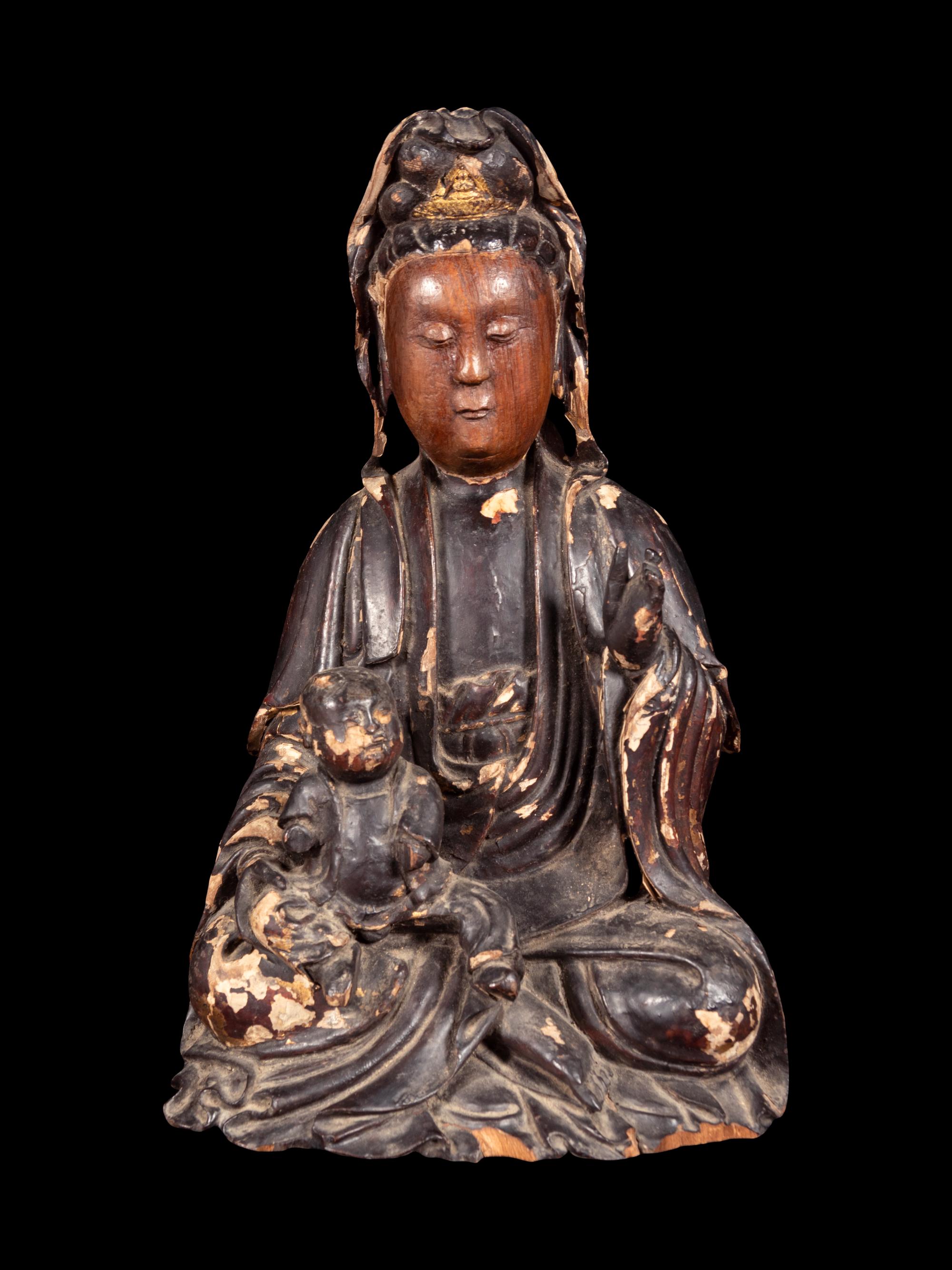 A Gilt Decorated Dark Brown Lacquered Wood Figure of Guanyin and Child