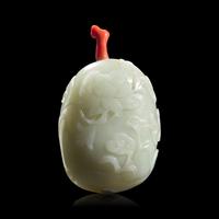 A Chinese Carved Celadon and Russet Jade Snuff Bottle