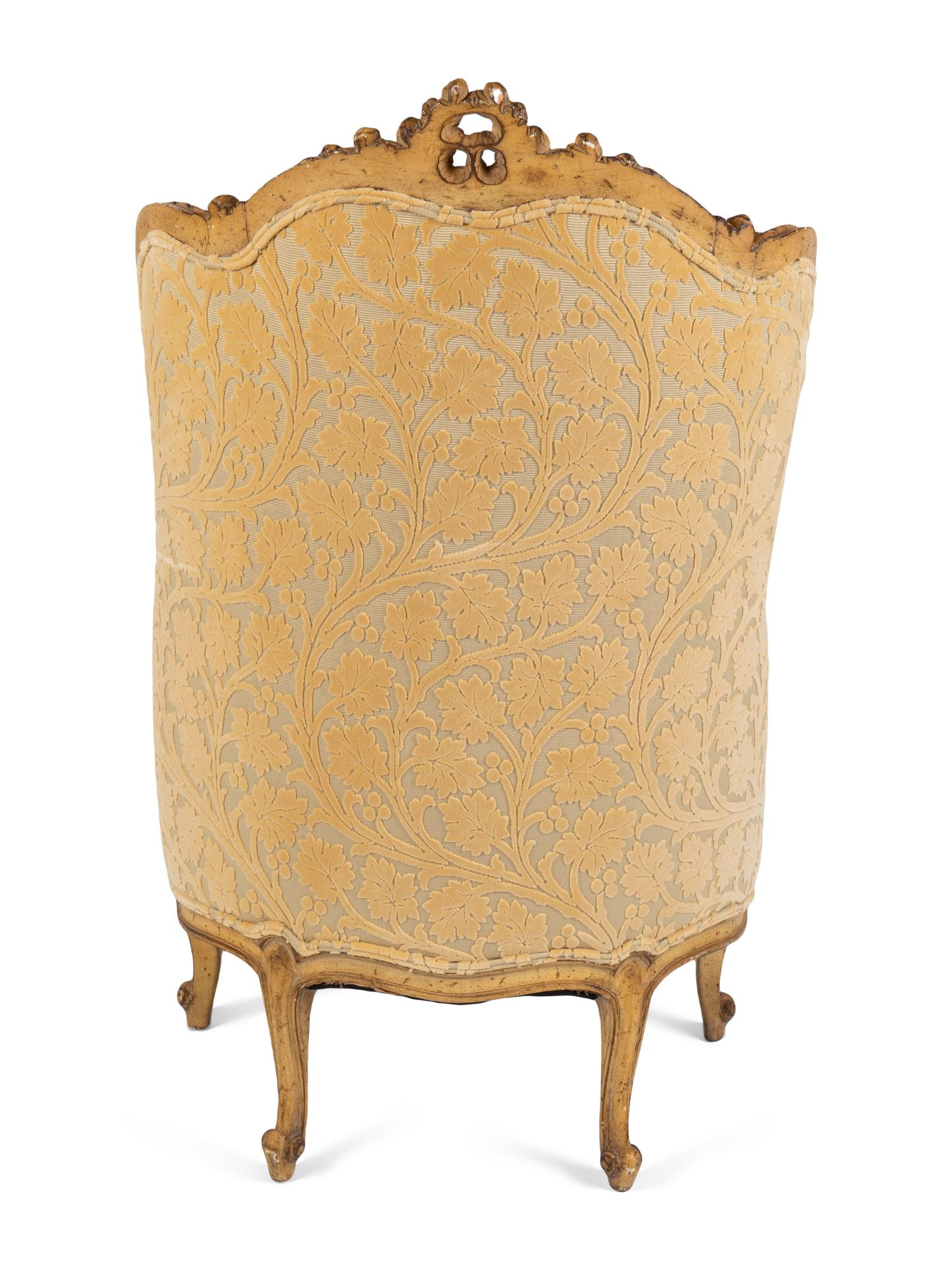 A Louis XV Style Carved and Painted Bergere A Oreille — 19TH CENTURY