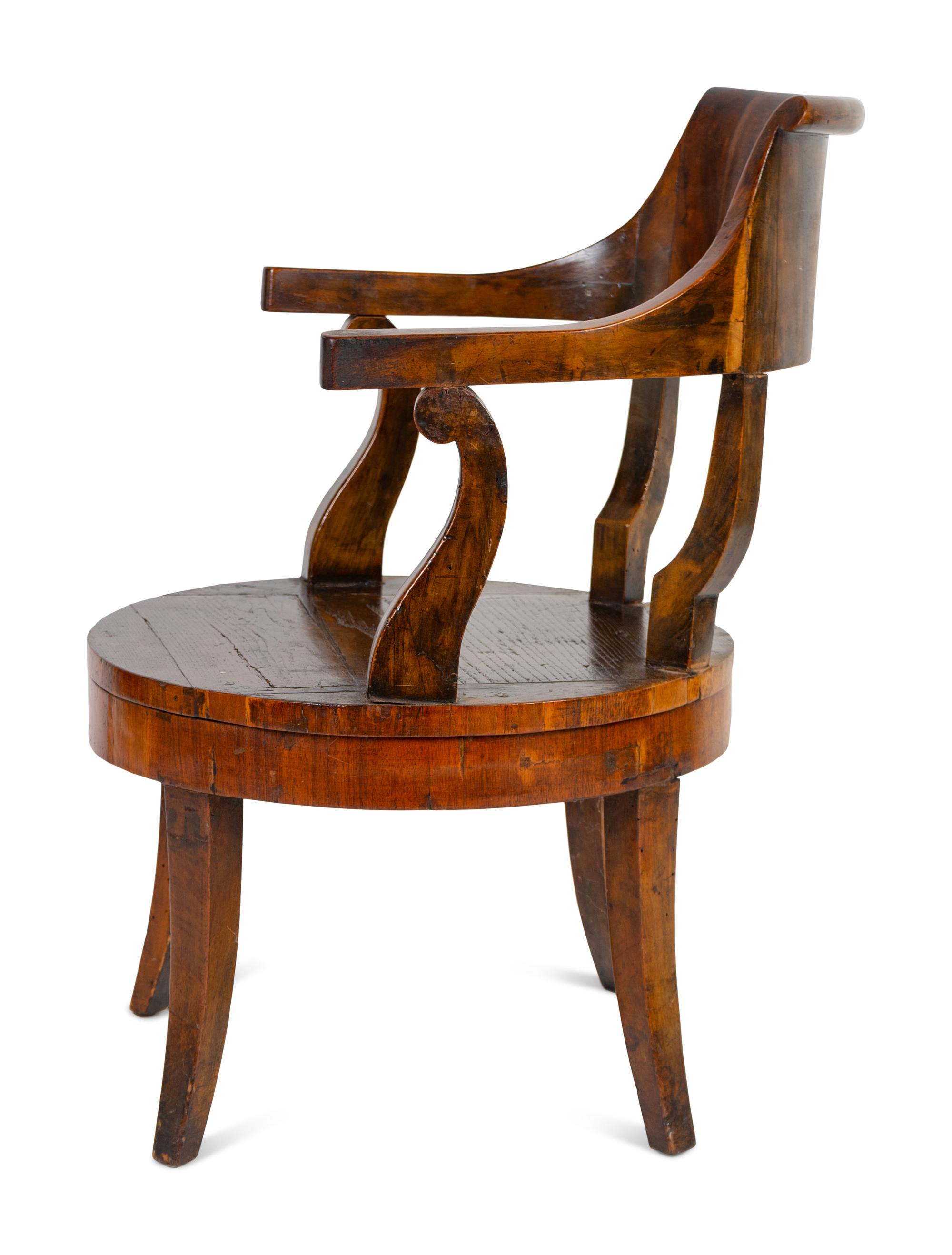 A Continental Barrel-Back Armchair