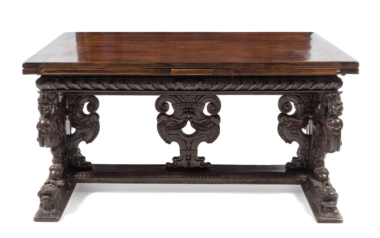An Italian Baroque Carved Walnut Refectory Table Height 34 1/4 x width 63 3/4 (closed) x depth 36 1/8 inches. — FLORENCE, 16TH CENTURY AND LATER