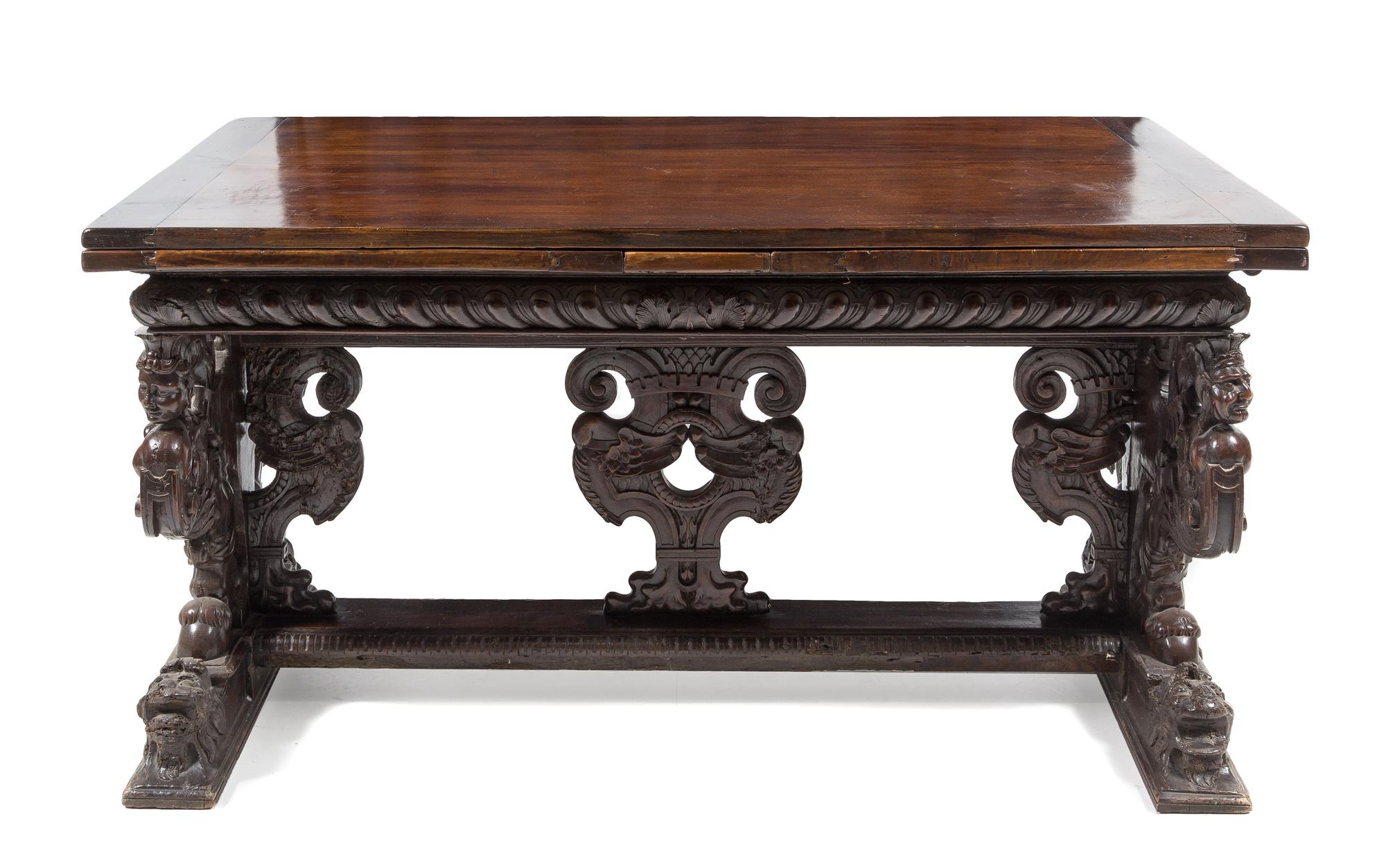 An Italian Baroque Carved Walnut Refectory Table Height 34 1/4 x width 63 3/4 (closed) x depth 36 1/8 inches. — FLORENCE, 16TH CENTURY AND LATER