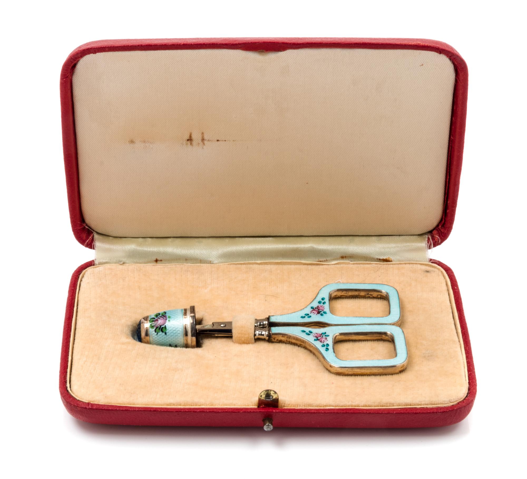 A German Silver and Guilloche Enamel Thimble and Scissors Set, Second Half 20th Century, the thimble having a blue glass top with a pal