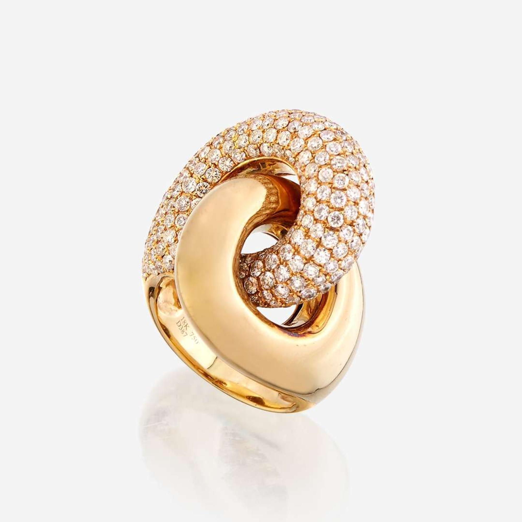 An eighteen karat gold and diamond ring