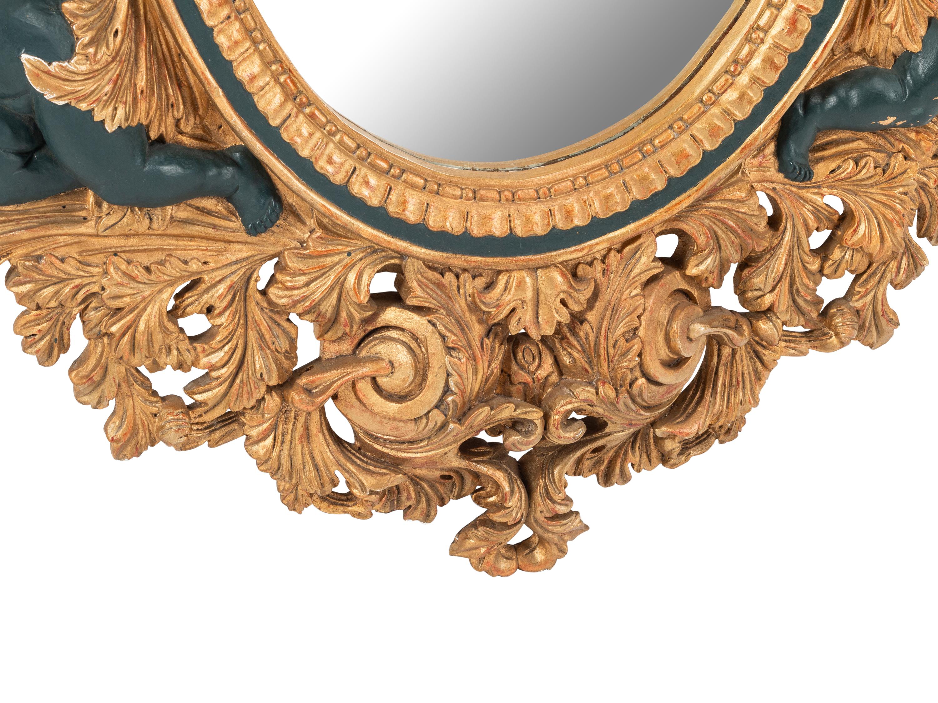 An Italian Baroque Style Gilt Mirror with Ebonized Cherubs