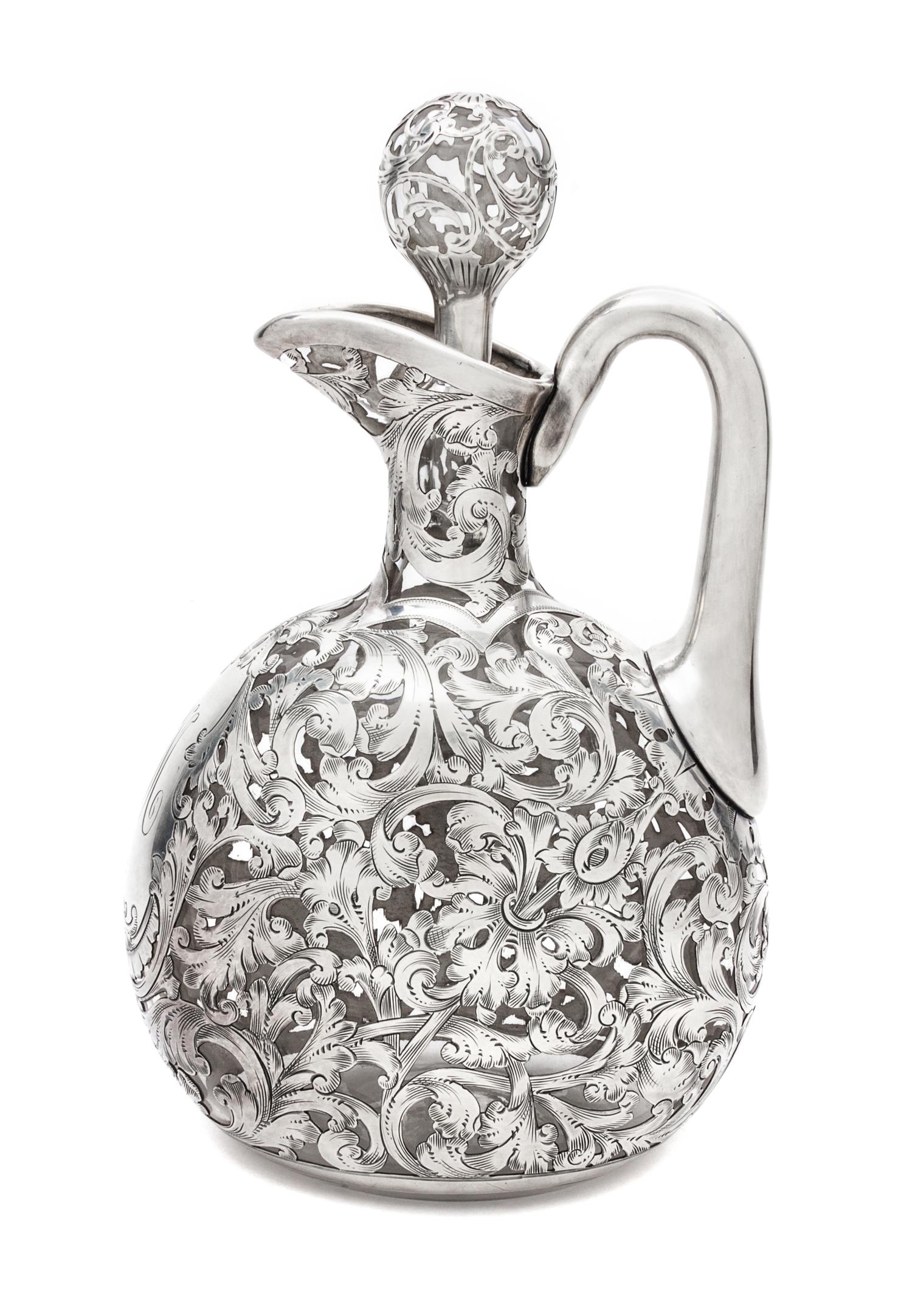 A Silver Overlay Glass Ewer Height 8 3/4 inches.
