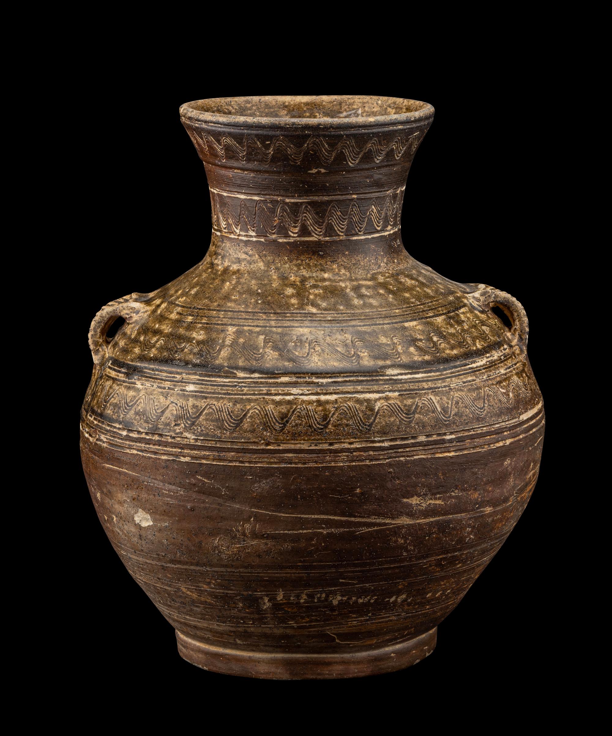 A Chinese Dark Green Glazed Pottery Handled Vase