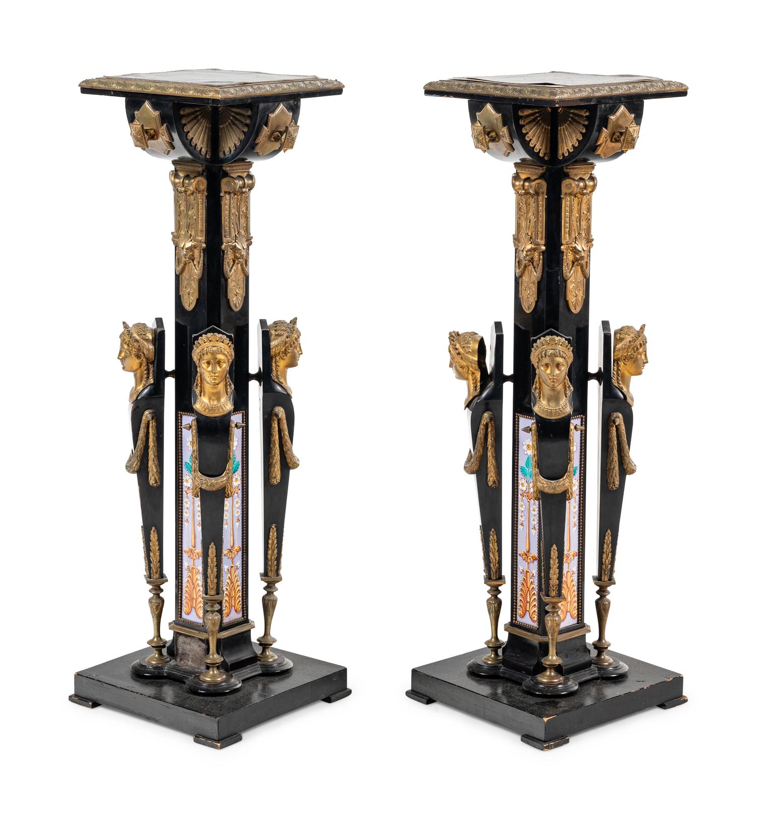 A Pair of Egyptian Revival Gilt Bronze and Porcelain Mounted Ebonized Pedestals