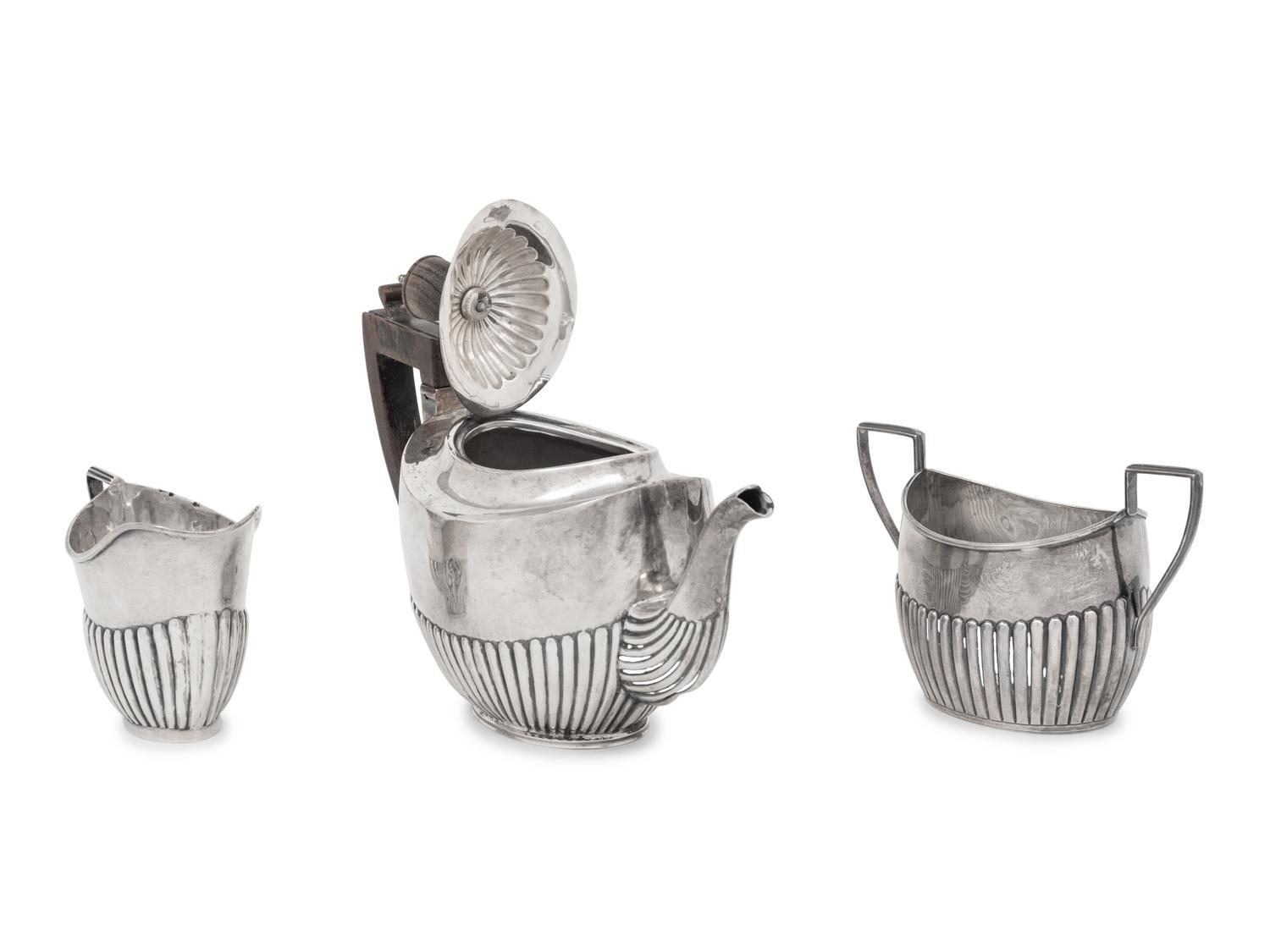 An Assembled Edwardian Silver Three-Piece Bachelor's Tea Service