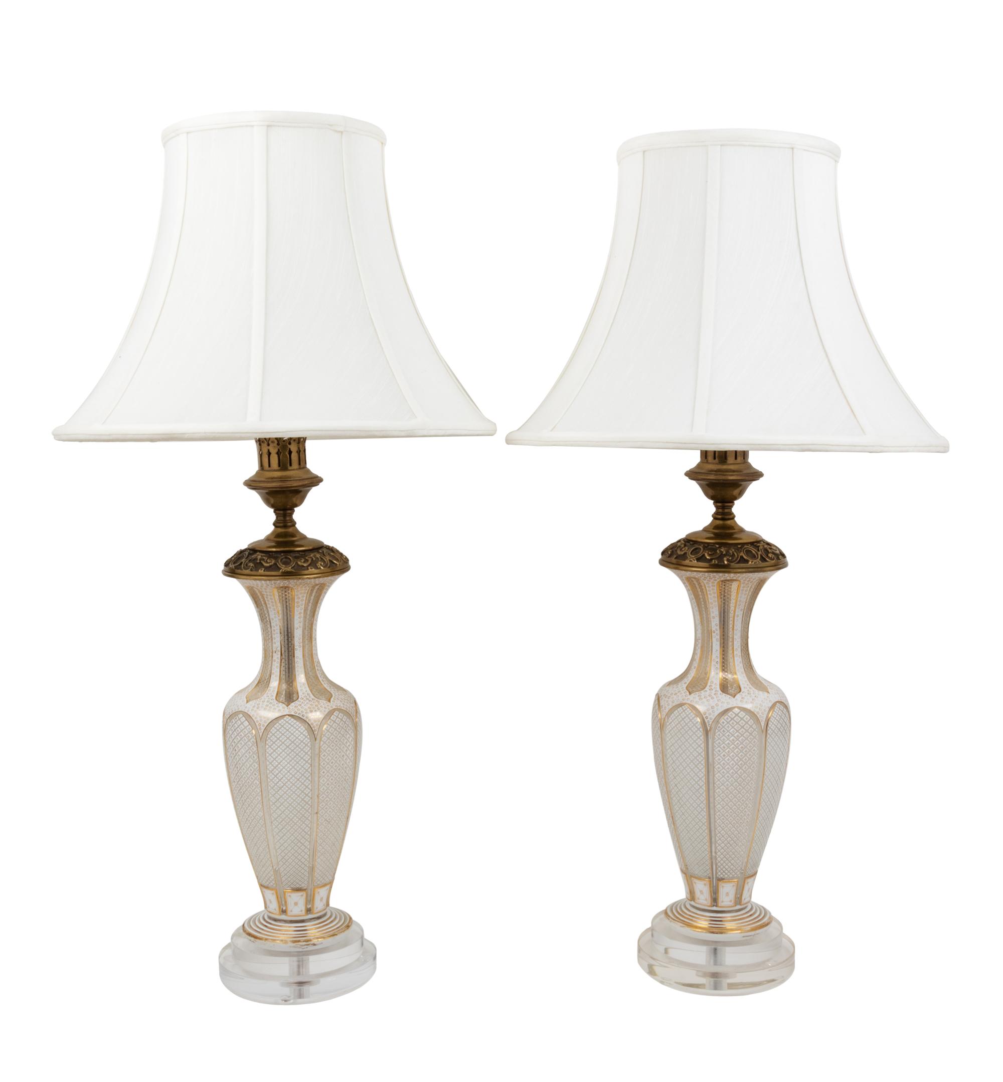 A Pair of Bohemian Parcel Gilt and Enamel Decorated Cut Glass Lamps
