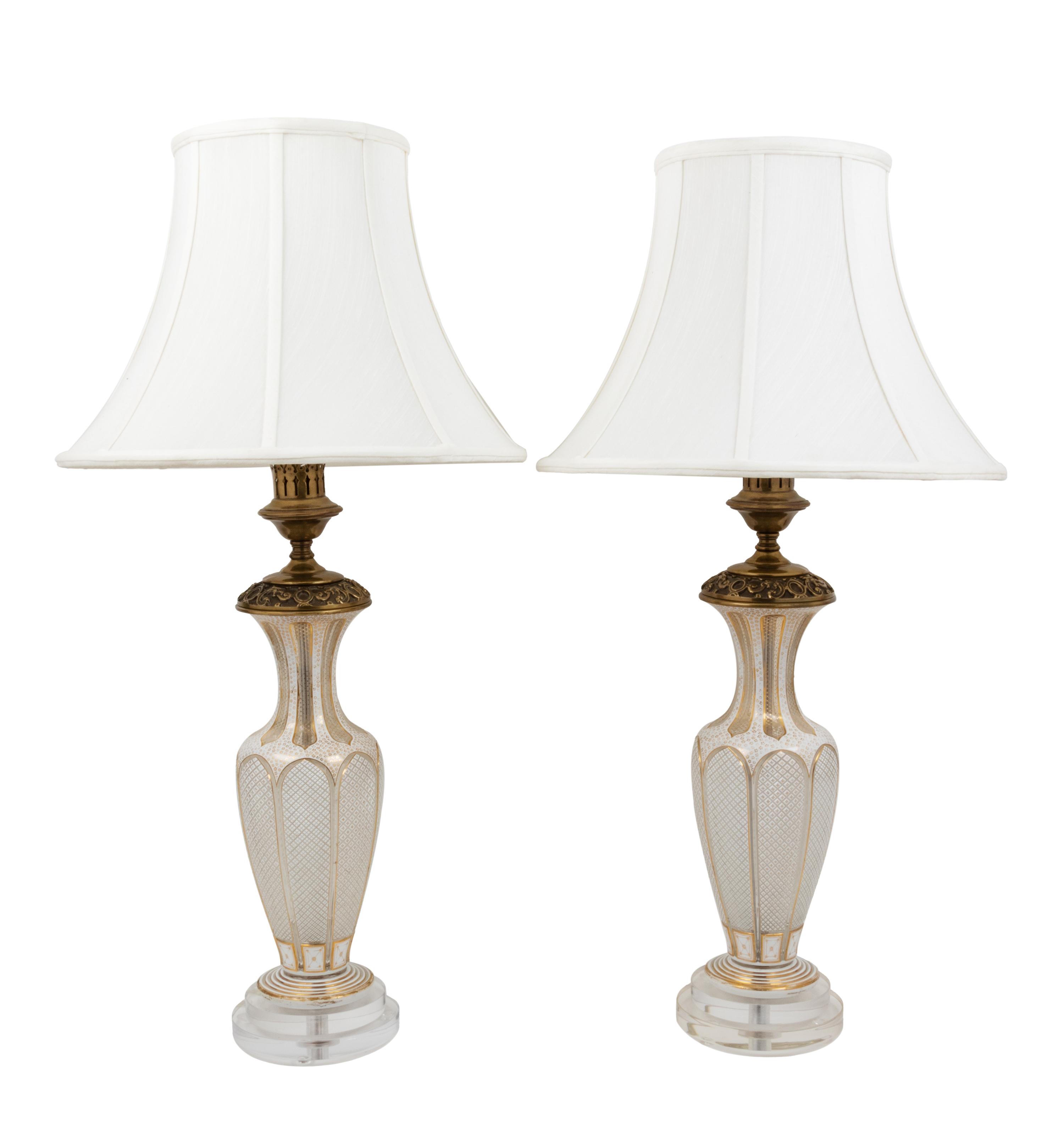 A Pair of Bohemian Parcel Gilt and Enamel Decorated Cut Glass Lamps